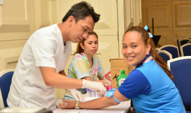 Cruise ship seminar participants having voluntary HIV tests 