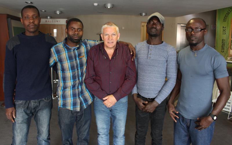 KEN FLEMING WITH JOSHUA, JAMES, NOEL AND JOHN WHO WERE SAVED FROM AN IRISH FISHING VESSEL