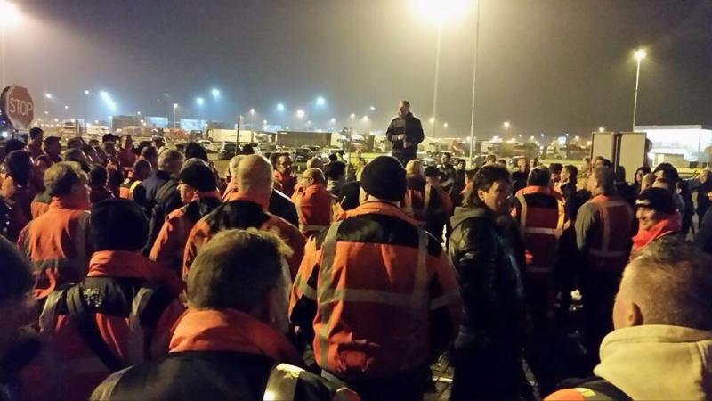 Dockers in the Port of Rotterdam are given news of the agreement